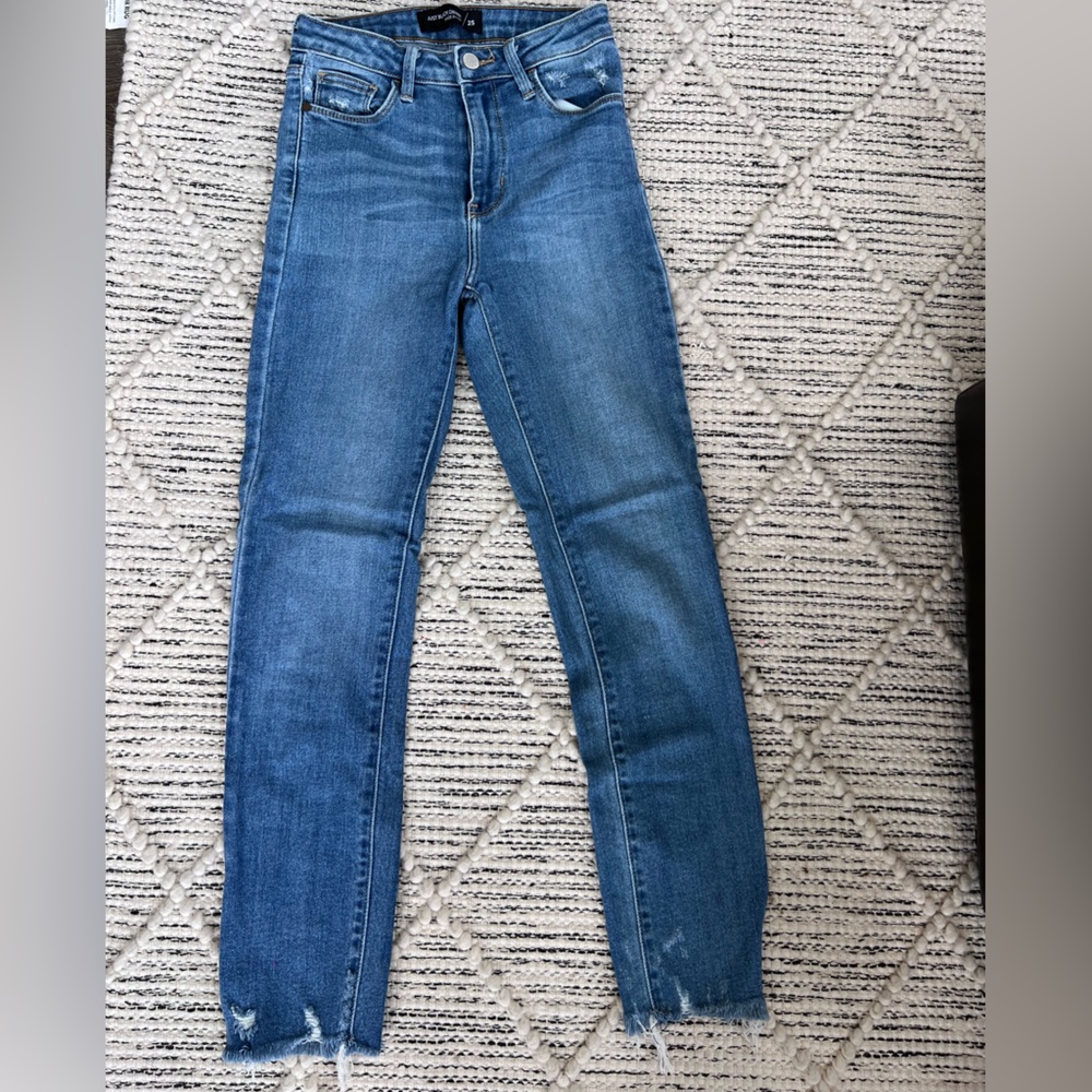 Just black skinny medium wash jeans with fringe bottom